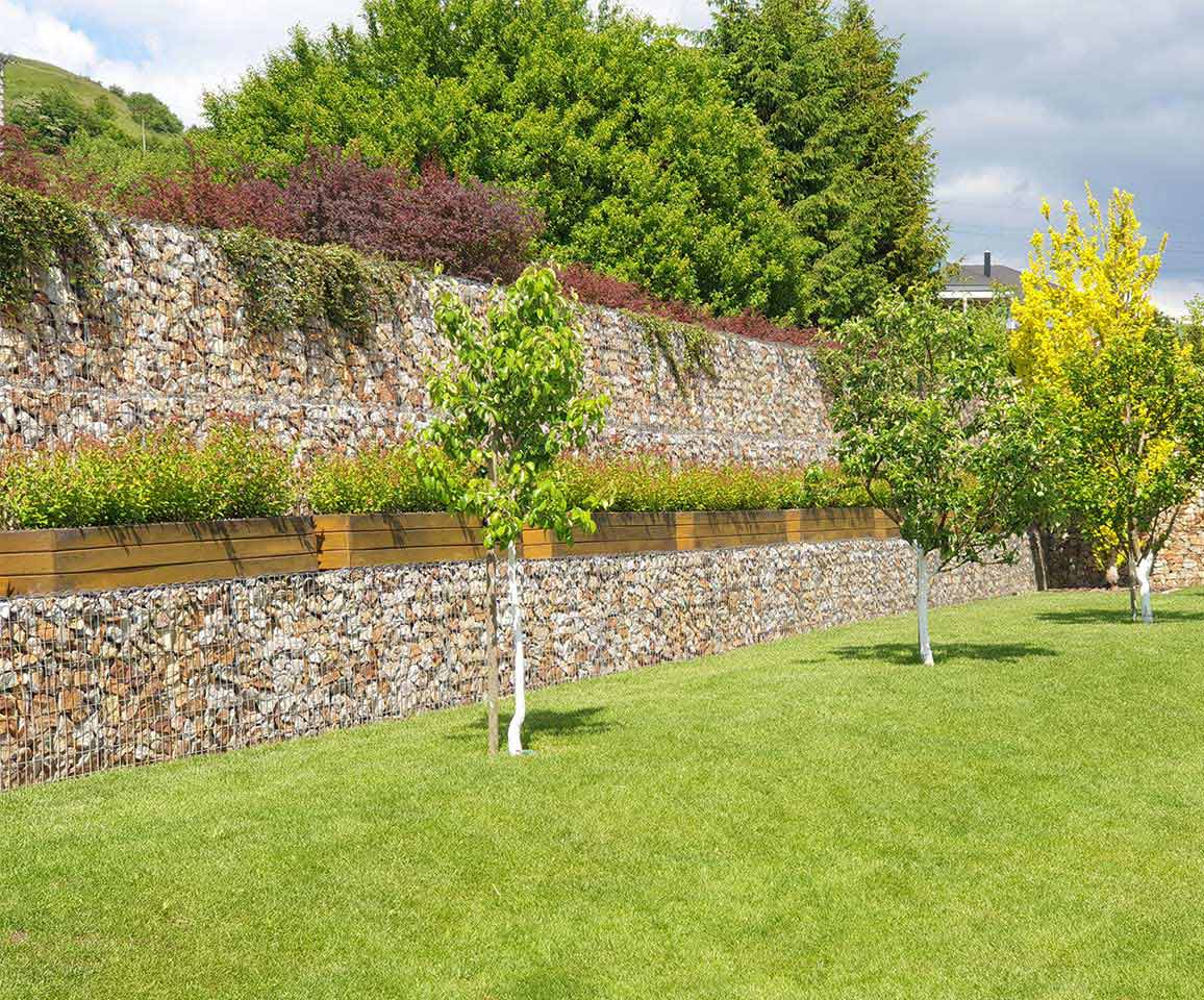 gabion retaining wall with green lawn