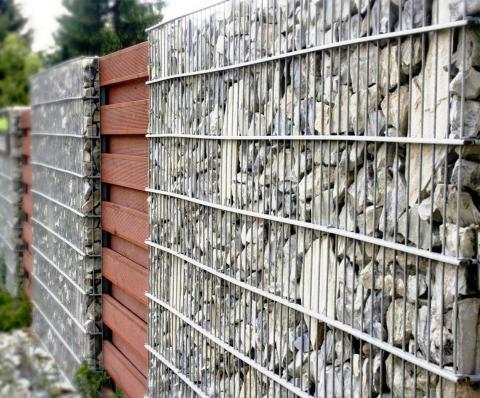 wooden fence in combination with gabions