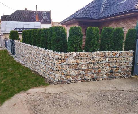 light brown gabion with hedge