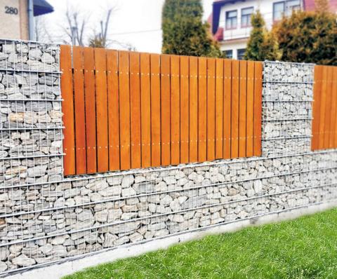 a bright gabion fence with wood