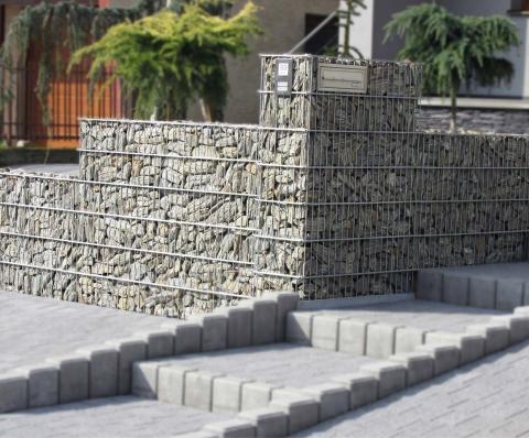custom gabion fence with bell and sign