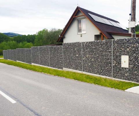 practical gabion fence with a niche for a meter
