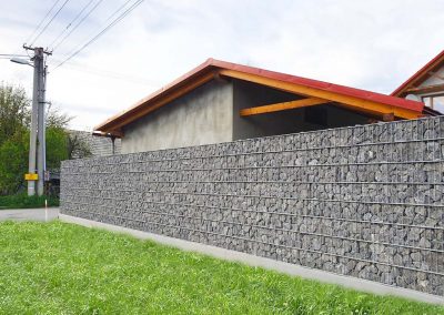 gabion fence with hand laying grey stone 