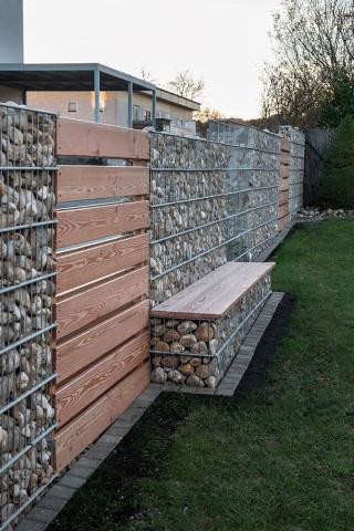 gabion bench as part of a gabion fence