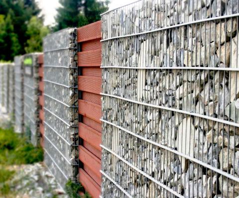 of wood in a gabion fence